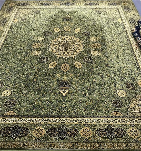 A Wilton broadloom Persian design green ground carpet 317 x 276cm